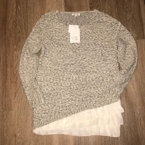 neutral toned tunic with ruffles